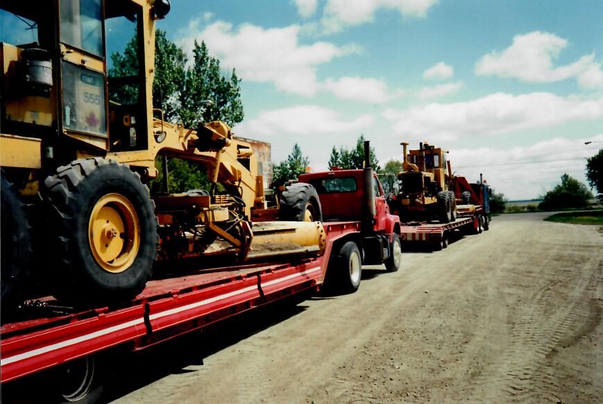 road grader on trailer